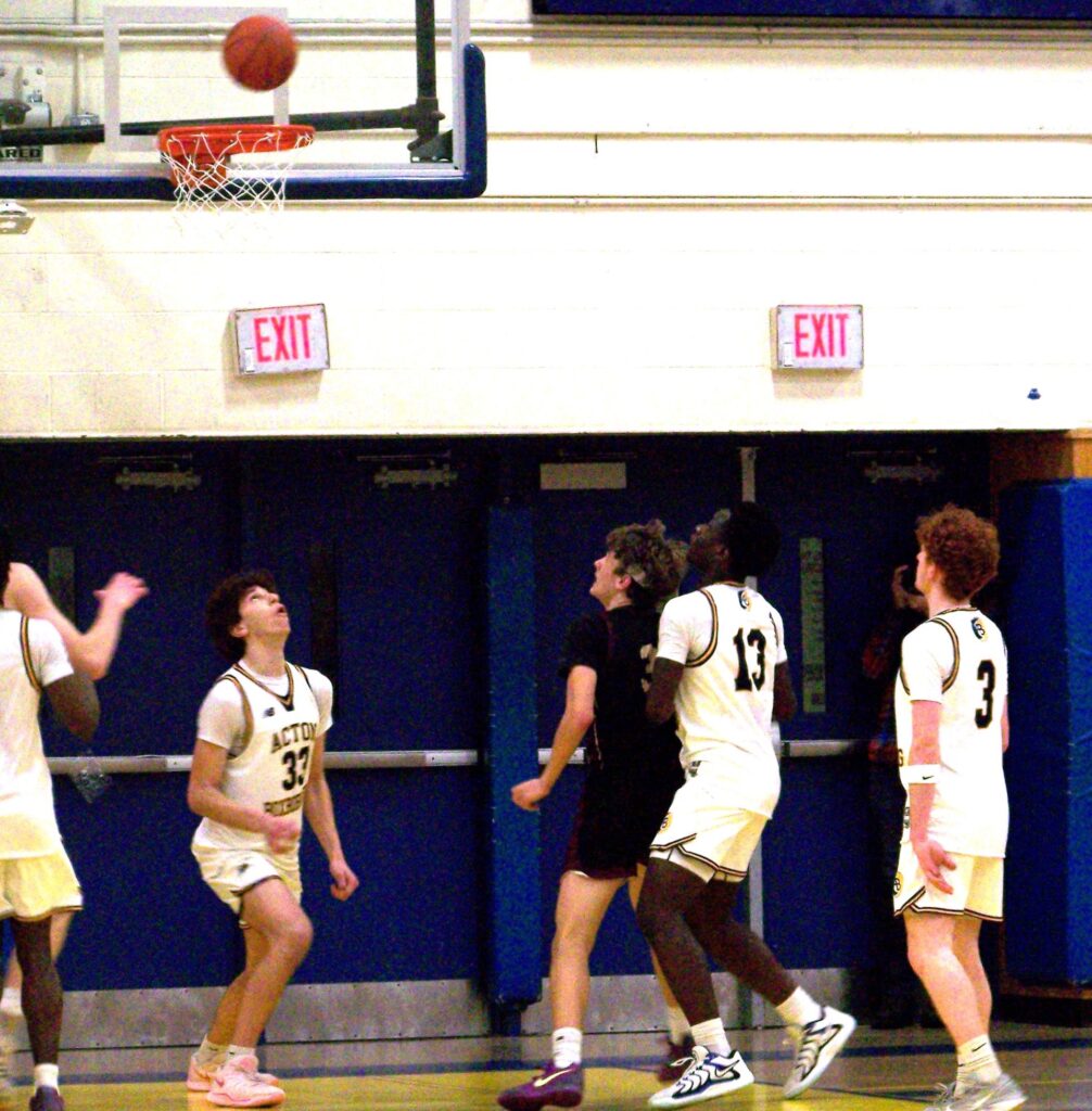 A bunch of AB plaers, and one CC player, watch the ball right before it heads into the hoop.