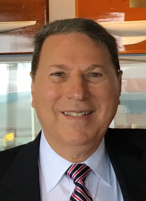 A man wearing a red, white, and blue striped tie.