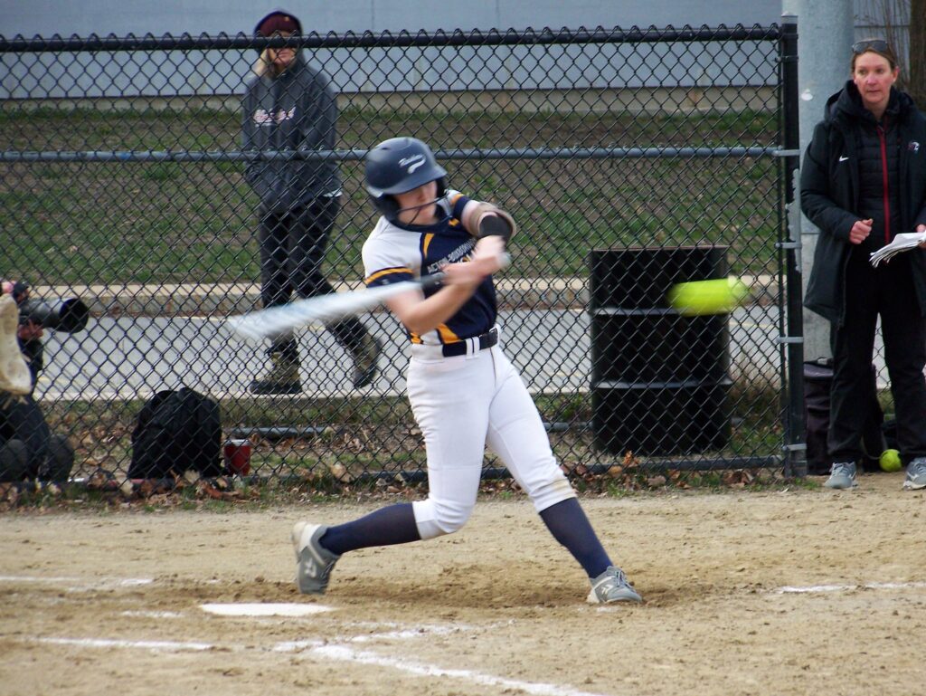 A Revs player gets ready to swing at an incoming pitch.