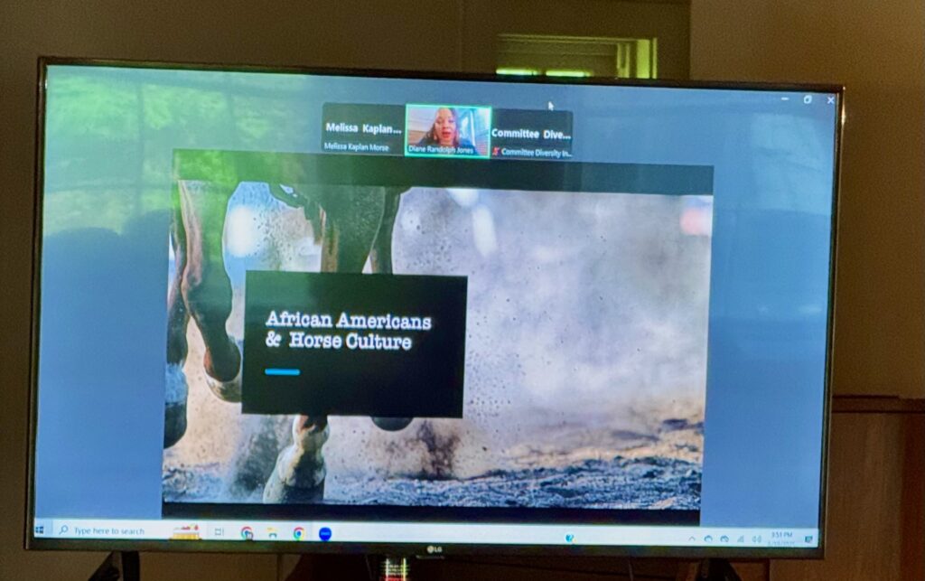 A picture of a screen with a Zoom meeting. The main image has a picture of a horse in the background and the label, " African Americans & Horse Culture."