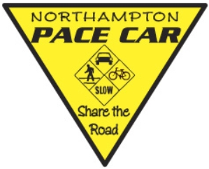 A yellow triangular bumper sticker that says "Northampton PACE CAR" and "Share the road."