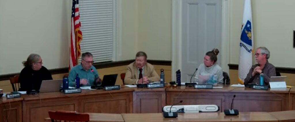 The five members of the Select Board discuss an issue in Room 204.