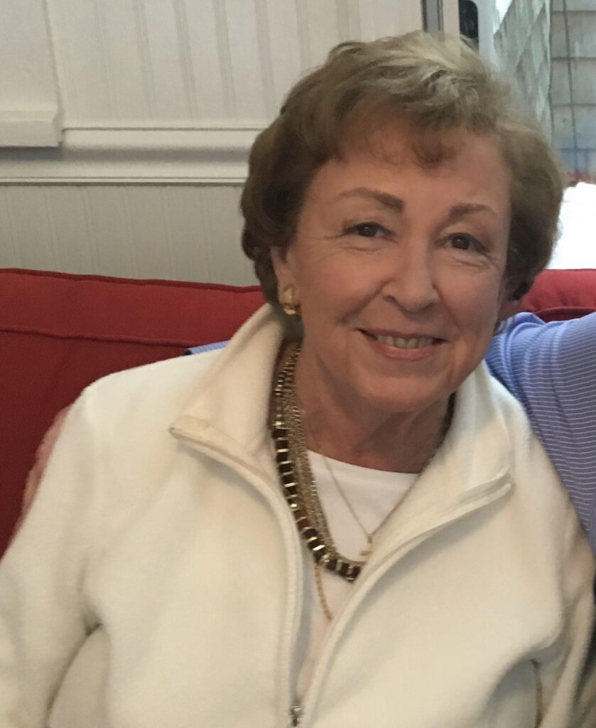 A smiling woman with light brown hair