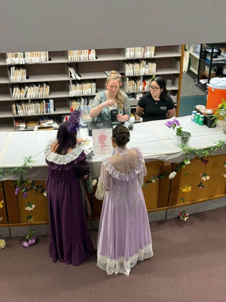 The circulation desk is miraculously transformed into a bar for the evening, with beer, wine, and mocktails from True West. Photo: Alissa Nicol